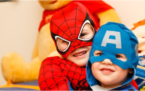 Kids dressed as superheroes during a play session